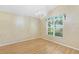 A bright dining room features wood floors and a decorative chandelier at 25025 Cranes Roost Cir, Leesburg, FL 34748