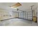 Spacious two-car garage with ample storage and an automatic door opener at 25025 Cranes Roost Cir, Leesburg, FL 34748