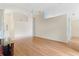 Open concept living room features light wood flooring and vaulted ceilings at 25025 Cranes Roost Cir, Leesburg, FL 34748