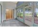 Enclosed porch with windows, with views of a tree and nature at 25025 Cranes Roost Cir, Leesburg, FL 34748