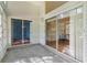 Enclosed patio with sliding glass doors, offers indoor-outdoor living at 25025 Cranes Roost Cir, Leesburg, FL 34748