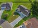 Aerial view showcasing a home with patterned driveway and a spacious backyard at 2557 Privada Dr, The Villages, FL 32162