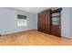 Bedroom with laminate floors, and built-in wardrobe and shelving at 2557 Privada Dr, The Villages, FL 32162