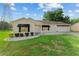 Well-maintained home with a neatly landscaped front yard, awnings, and a cozy entrance at 2557 Privada Dr, The Villages, FL 32162