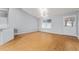 Spacious living room with neutral walls, ceiling fan, and a bright window at 2557 Privada Dr, The Villages, FL 32162