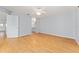 Main bedroom with ensuite bath and laminate floors at 2557 Privada Dr, The Villages, FL 32162