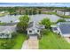 Beautiful lakefront home with solar panels, lush landscaping and community lake views at 2610 Florence Dr, Kissimmee, FL 34744