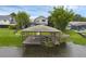 Aerial view showcasing a waterfront property with a dock, lush greenery, and serene surroundings at 2610 Florence Dr, Kissimmee, FL 34744