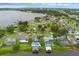 Waterfront home features a pool, boat house with lift, and solar panels for energy efficiency at 2610 Florence Dr, Kissimmee, FL 34744