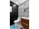 Stylish powder room featuring black and white patterned tile and modern fixtures at 2610 Florence Dr, Kissimmee, FL 34744