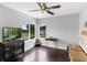 Bright bedroom with hardwood floors, two windows offering natural light, and a cozy atmosphere at 2610 Florence Dr, Kissimmee, FL 34744