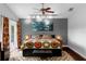 Bright bedroom with unique decor, hardwood floors, and access to the outdoors at 2610 Florence Dr, Kissimmee, FL 34744