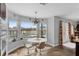 Bright breakfast nook with lake views, stylish light fixture, and convenient access to the outdoor patio at 2610 Florence Dr, Kissimmee, FL 34744