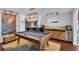 Game room with a pool table, modern lighting, and stylish cabinets for entertaining at 2610 Florence Dr, Kissimmee, FL 34744