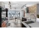 Gourmet kitchen with modern appliances, stylish backsplash, breakfast nook with lake view, and unique light fixtures at 2610 Florence Dr, Kissimmee, FL 34744