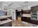 Modern kitchen with custom cabinetry, stainless steel appliances, decorative backsplash, and stylish track lighting at 2610 Florence Dr, Kissimmee, FL 34744