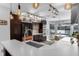 Contemporary kitchen with stainless steel appliances, a breakfast bar, and a view of the water at 2610 Florence Dr, Kissimmee, FL 34744