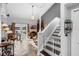 Living room featuring slate floors, views to the water, and easy access to the stairs at 2610 Florence Dr, Kissimmee, FL 34744