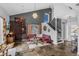 Inviting living room with stylish decor, a vaulted ceiling, and an open staircase at 2610 Florence Dr, Kissimmee, FL 34744