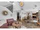 Open-concept living room with unique decor, slate floors, and abundant natural light at 2610 Florence Dr, Kissimmee, FL 34744