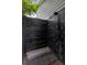 Private outdoor shower showcasing sleek black tiling and a contemporary design, adding a touch of luxury at 2610 Florence Dr, Kissimmee, FL 34744