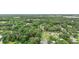 Aerial view of the wooded property and surrounding neighborhood at 27113 Robertson Rd, Yalaha, FL 34797