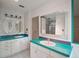 The bathroom has dual sinks and turquoise countertops at 27113 Robertson Rd, Yalaha, FL 34797