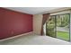 Bright bedroom features a sliding glass door and view of the yard at 27113 Robertson Rd, Yalaha, FL 34797
