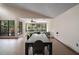 Dining area with large windows showing views of the landscaped yard at 27113 Robertson Rd, Yalaha, FL 34797