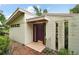 Modern home exterior with unique design elements and a landscaped walkway at 27113 Robertson Rd, Yalaha, FL 34797