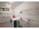 Well-lit laundry room with washer, dryer, and ample storage at 27113 Robertson Rd, Yalaha, FL 34797