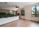 Spacious living area features a ceiling fan and expansive windows with natural light at 27113 Robertson Rd, Yalaha, FL 34797