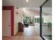 Open-concept living room with high ceilings and large windows showcasing greenery at 27113 Robertson Rd, Yalaha, FL 34797