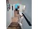 Hallway with hardwood floors that leads to a bedroom with blue walls at 27212 Orange Ave, Yalaha, FL 34797