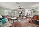 Comfortable living room with stylish decor, a fireplace, and a cozy seating arrangement at 27212 Orange Ave, Yalaha, FL 34797