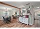 Open living space with hardwood floors, neutral tones, and traditional furniture at 27212 Orange Ave, Yalaha, FL 34797