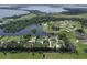 Picturesque aerial view of homes nestled amidst canals, lakes, and verdant landscapes at 29152 David Ct, Tavares, FL 32778