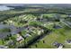 Panoramic aerial view of a residential area with houses bordering interconnected lakes and waterways at 29152 David Ct, Tavares, FL 32778