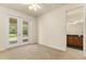 Bedroom featuring glass doors leading to the outside with an attached bathroom at 29152 David Ct, Tavares, FL 32778