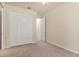 Bedroom features a large closet with white doors and neutral carpet at 29152 David Ct, Tavares, FL 32778
