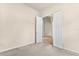 Bedroom showcases an open doorway leading to a view of elegant columns and tiled floors at 29152 David Ct, Tavares, FL 32778