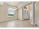 Elegant dining area with large windows, chandelier, and tile flooring at 29152 David Ct, Tavares, FL 32778