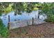 Dock on the water with an ladder into the water at 29152 David Ct, Tavares, FL 32778