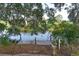Dock on the water with Spanish moss hanging from the trees at 29152 David Ct, Tavares, FL 32778