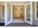 Exterior of home featuring doors leading to a screened in porch and bedroom at 29152 David Ct, Tavares, FL 32778