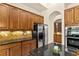 Well-equipped kitchen featuring granite countertops, stainless steel appliances, and ample storage at 29152 David Ct, Tavares, FL 32778