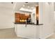 Modern kitchen features stylish pendant lights, a breakfast bar, and sleek countertops at 29152 David Ct, Tavares, FL 32778