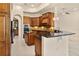 Gourmet kitchen with custom cabinetry, granite countertops, and stainless steel appliances at 29152 David Ct, Tavares, FL 32778