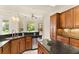 Inviting kitchen with granite counters, stainless appliances, and bright window views at 29152 David Ct, Tavares, FL 32778