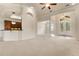 Spacious living room with high ceilings, large windows, and open access to the kitchen at 29152 David Ct, Tavares, FL 32778